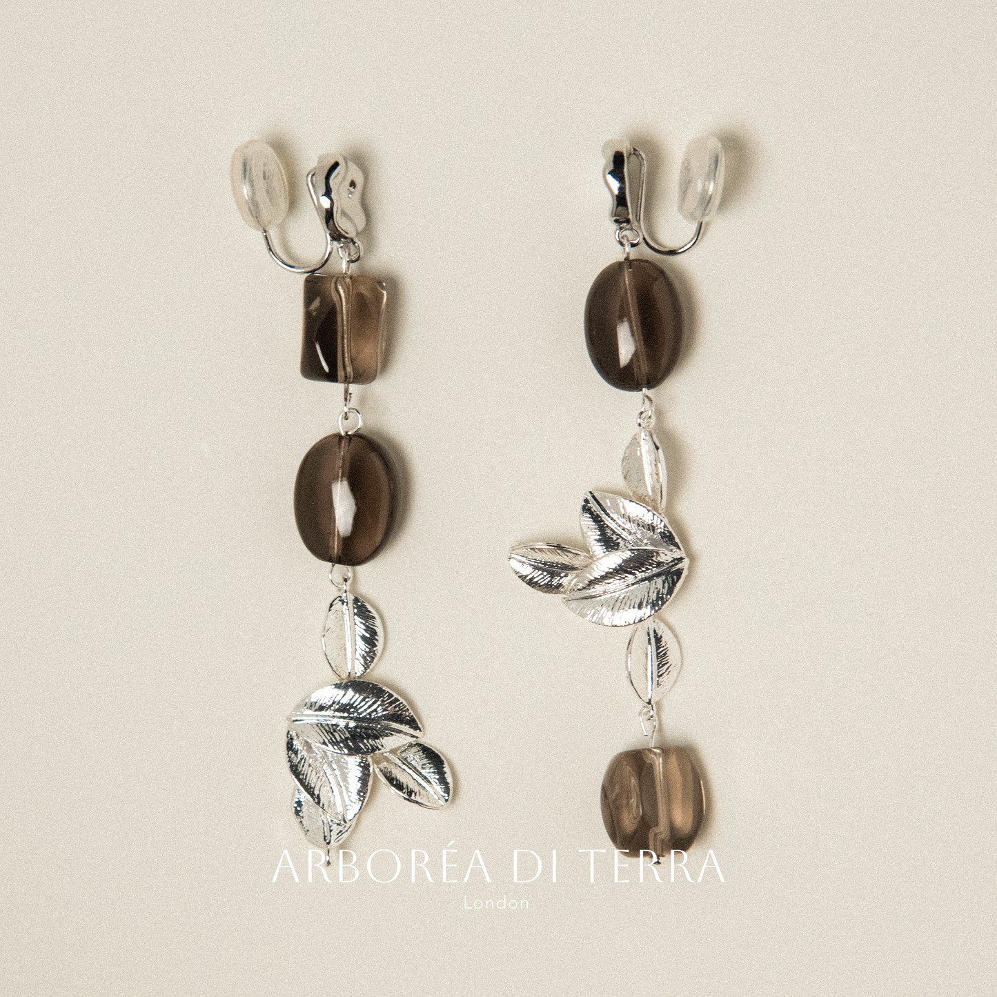 Silver plated leaf clip on earrings with smoky crystals